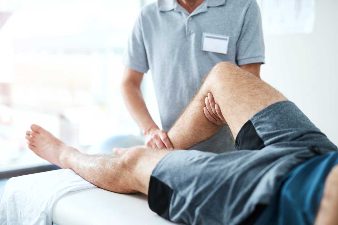 AI image of a man's leg being stretched by a physical therapist